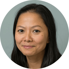 A close up of a woman 's face in a circle