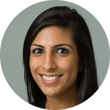 A woman with long dark hair is smiling in a circle