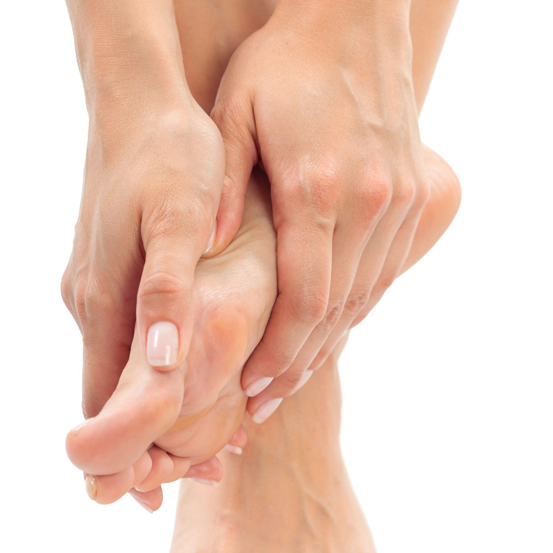 A close up of a woman 's hands and feet on a white background