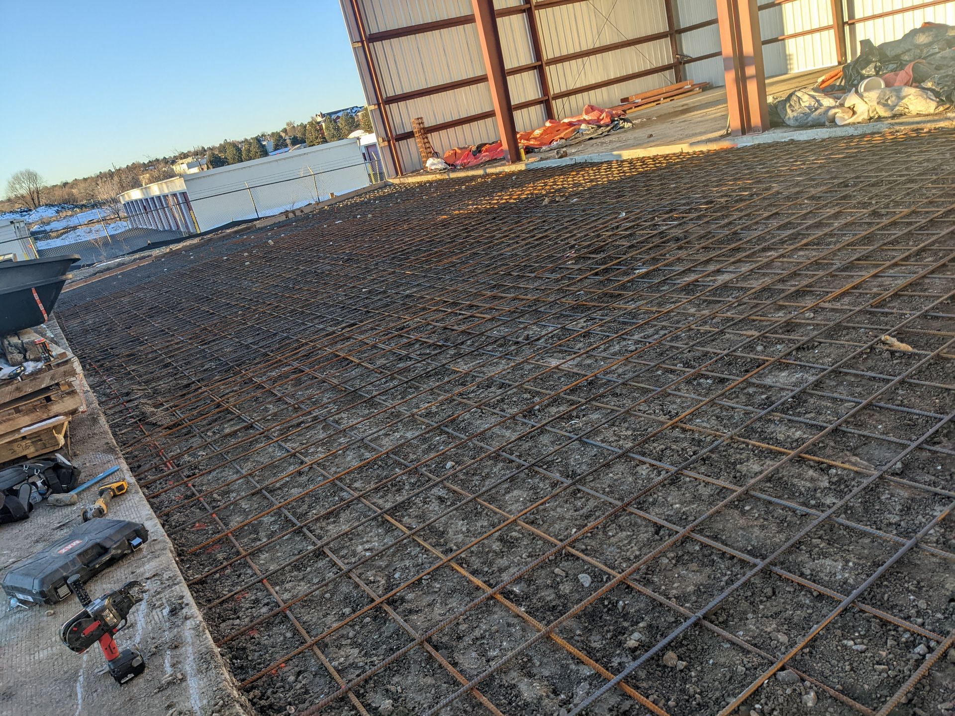 A concrete floor with a lot of wire mesh on it.