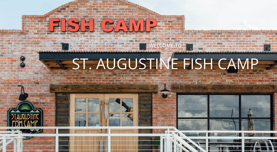 A brick building with a sign that says fish camp on it.