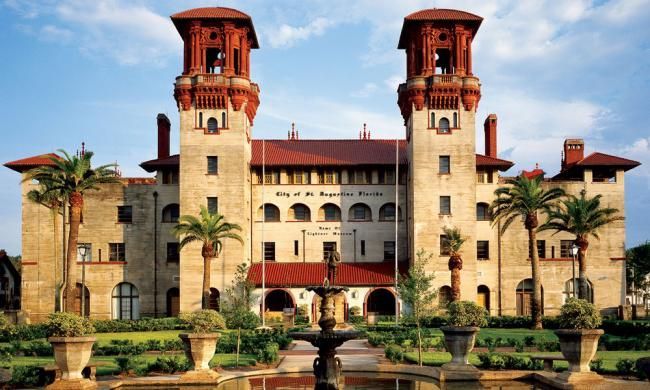 A large building with a fountain in front of it