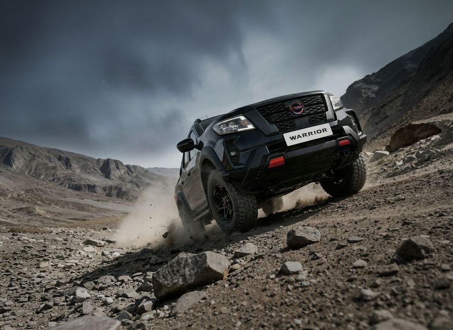 Navara Pro-4X Warrior racing through mud pools