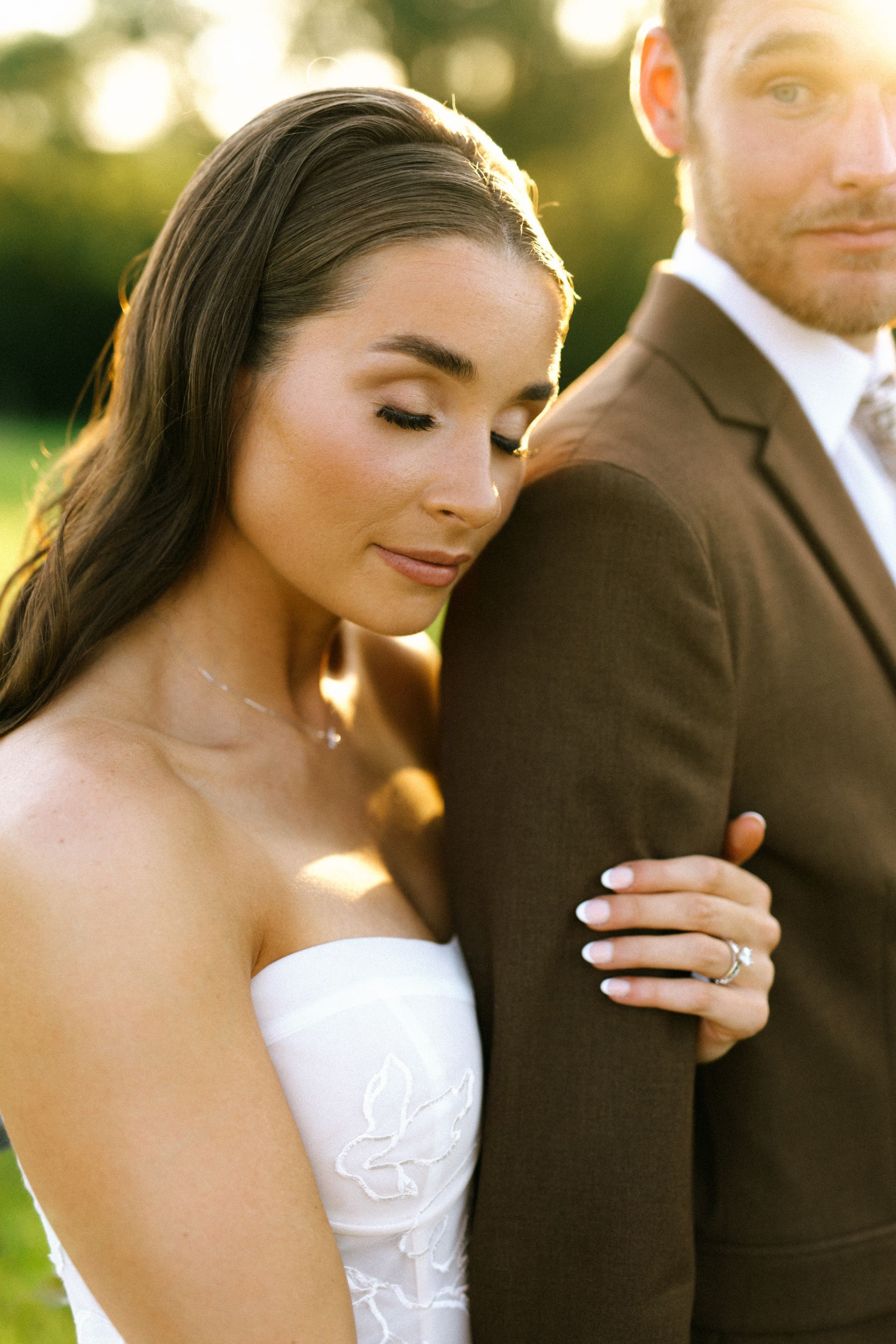 Bride hold groom's arm