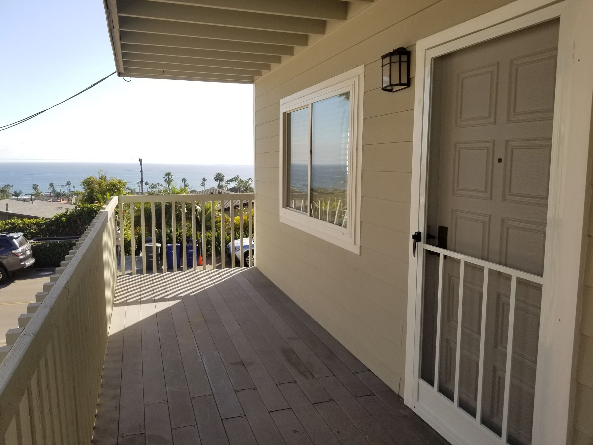 A house with a balcony overlooking the ocean