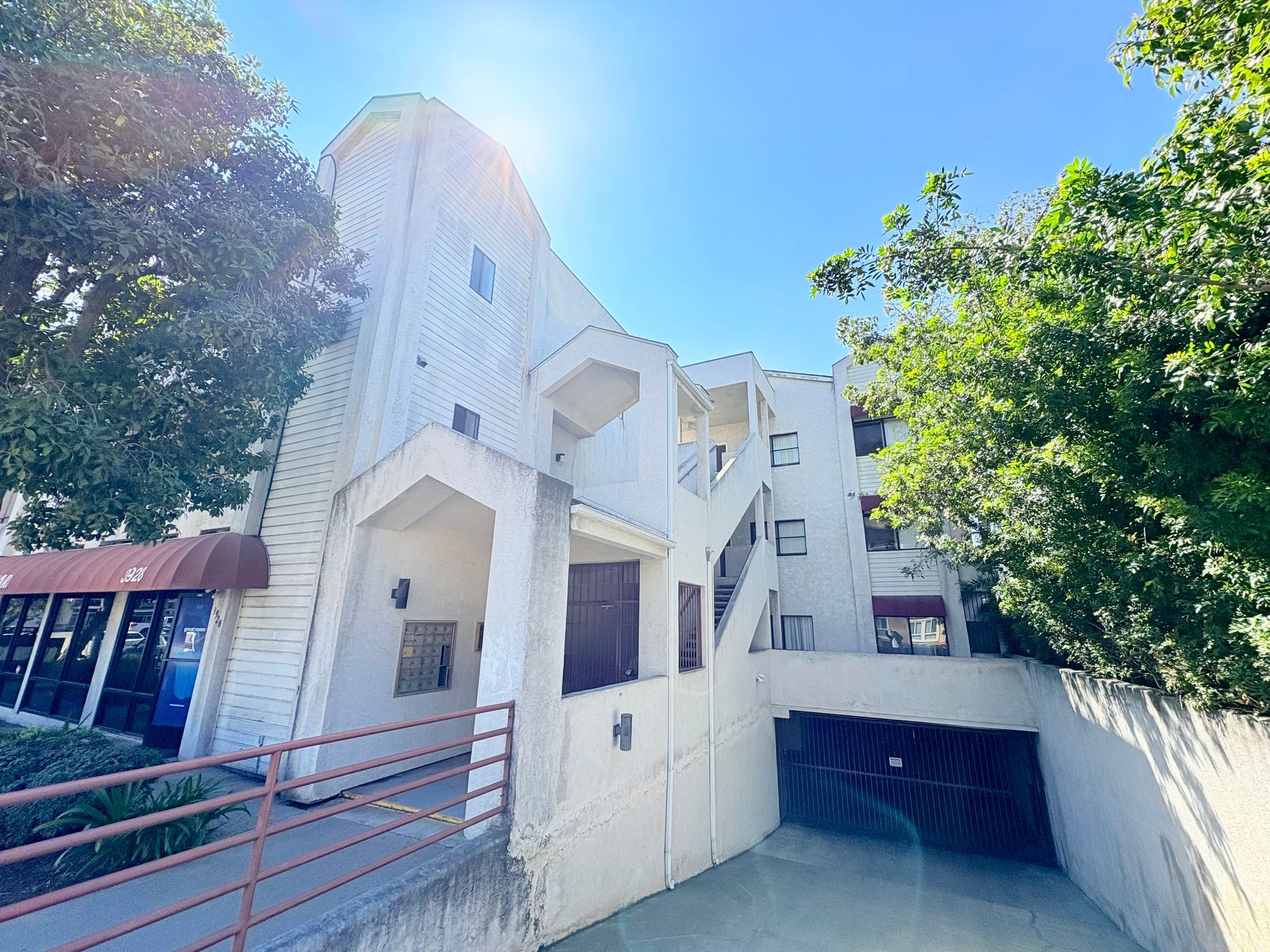 A large white building with a ramp leading to it