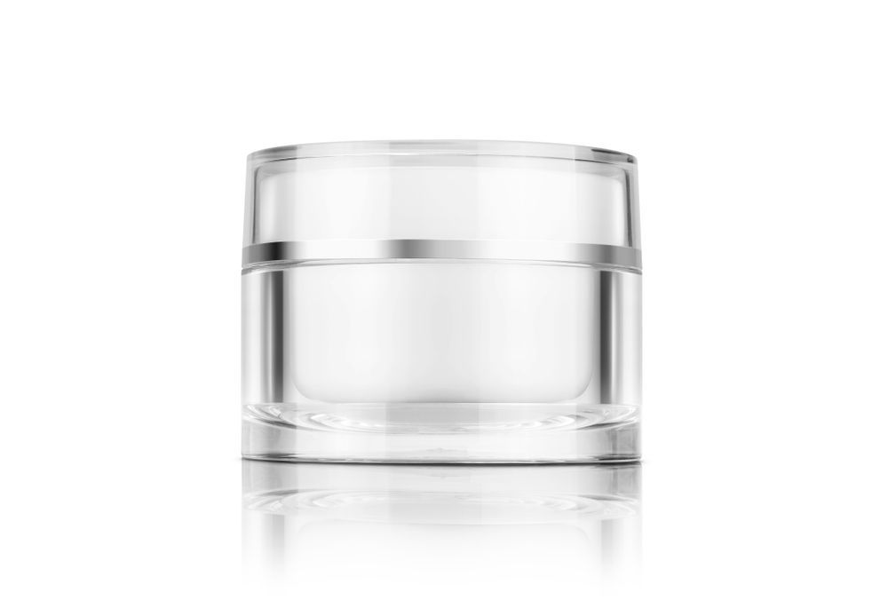 Clear Cosmetic Jar With a Silver Band on a White Surface, Reflecting Below — C & D Manufacturing In Caboolture, QLD