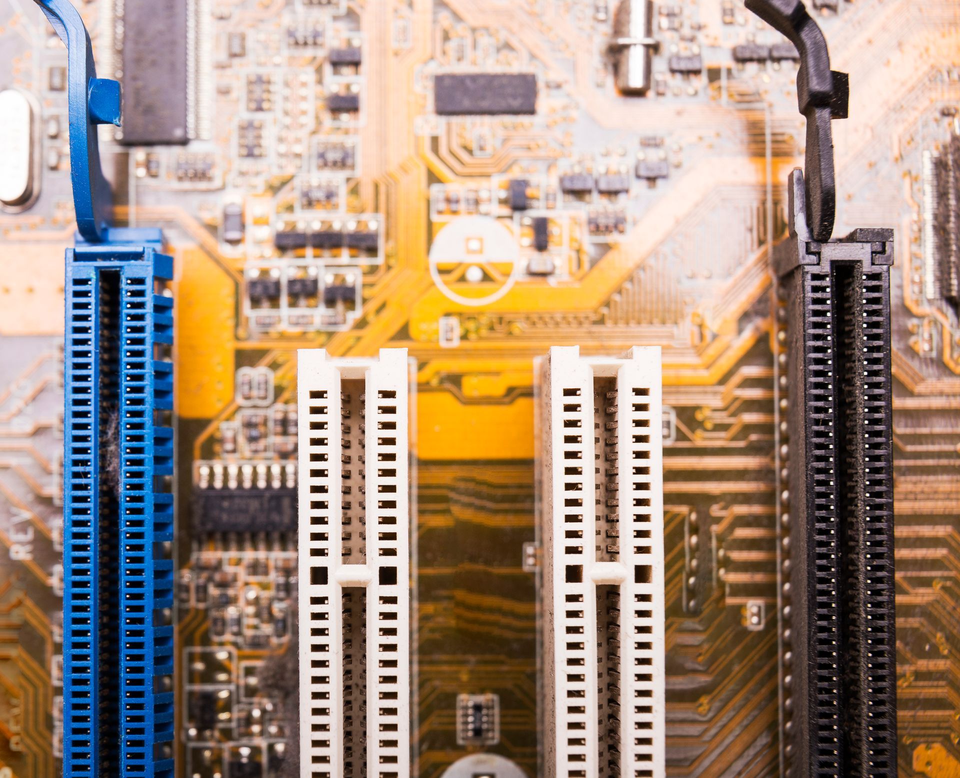 A close up of a computer motherboard with a lot of connectors
