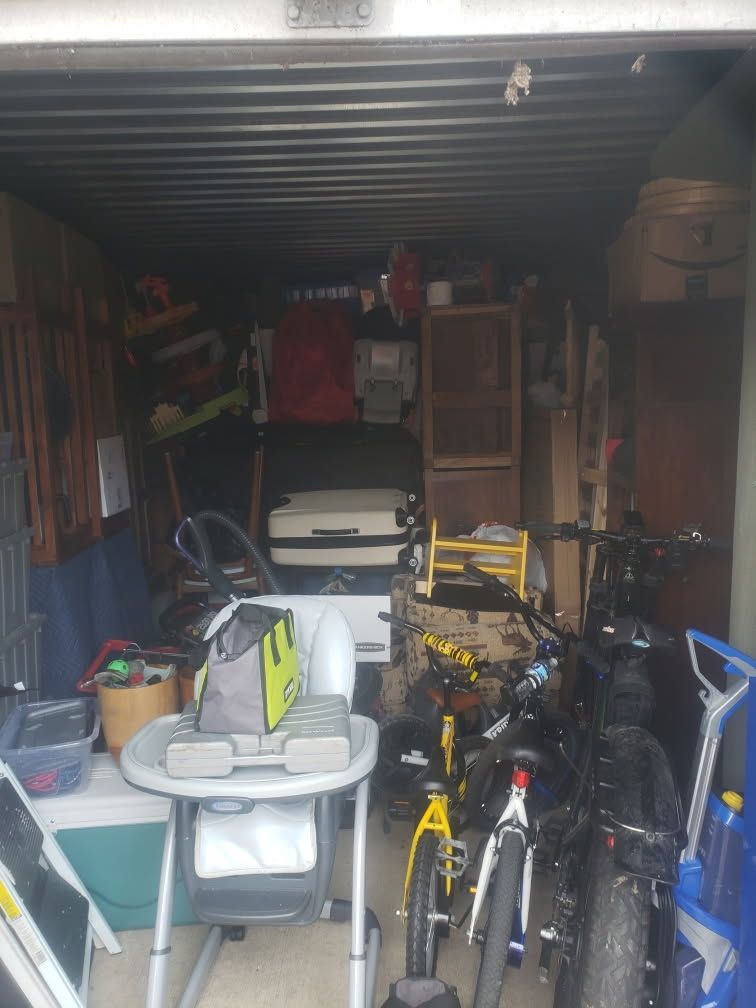 A garage filled with bikes and a high chair