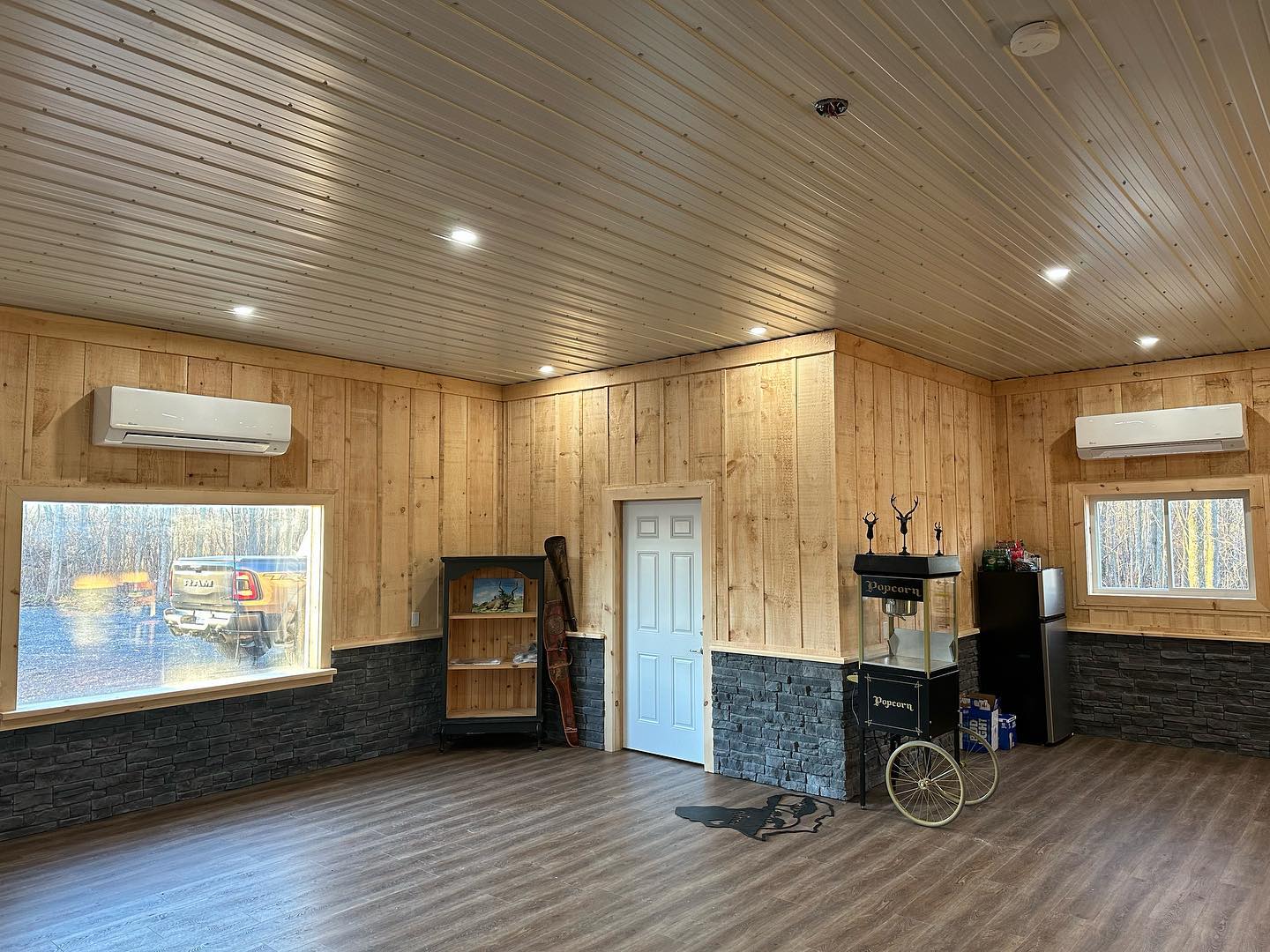 There is a popcorn machine in the middle of the room.