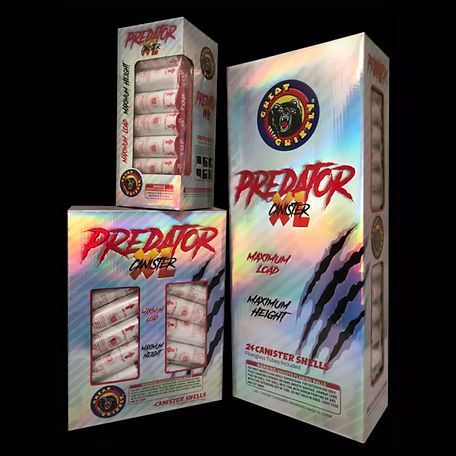 Three boxes of predator fireworks are sitting next to each other on a black background.