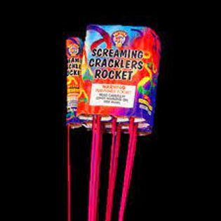 A close up of a screaming cracklers rocket on a black background.