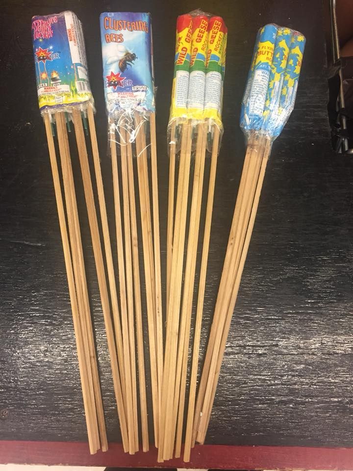A bunch of fireworks are sitting on a table