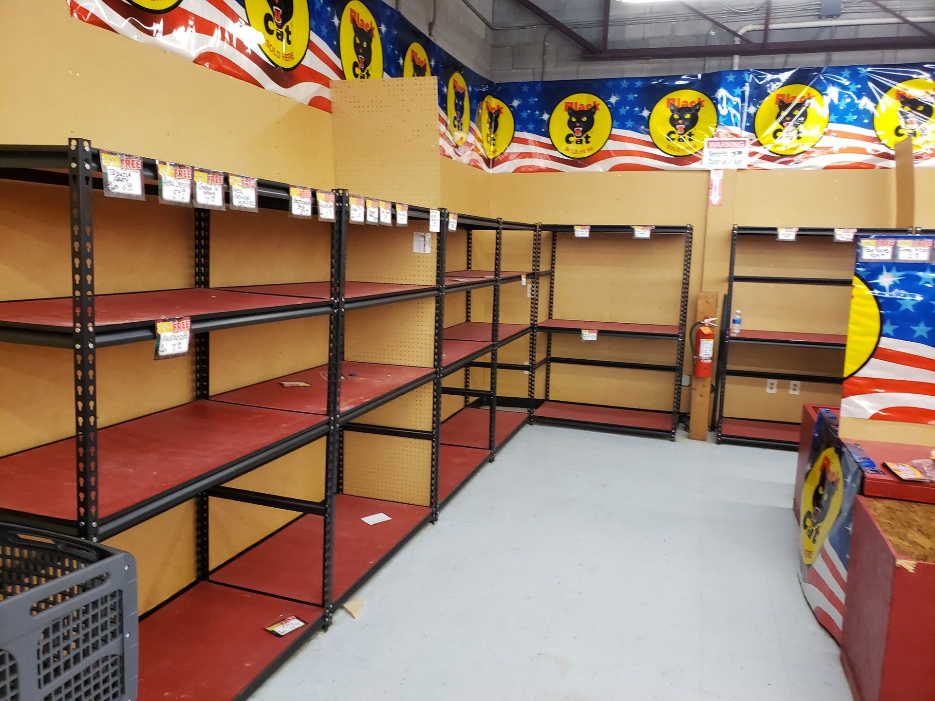 A room with a lot of empty shelves in it