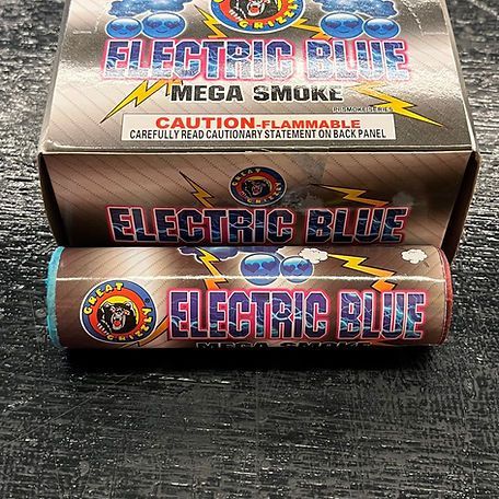 A box of electric blue mega smoke sitting on a table.