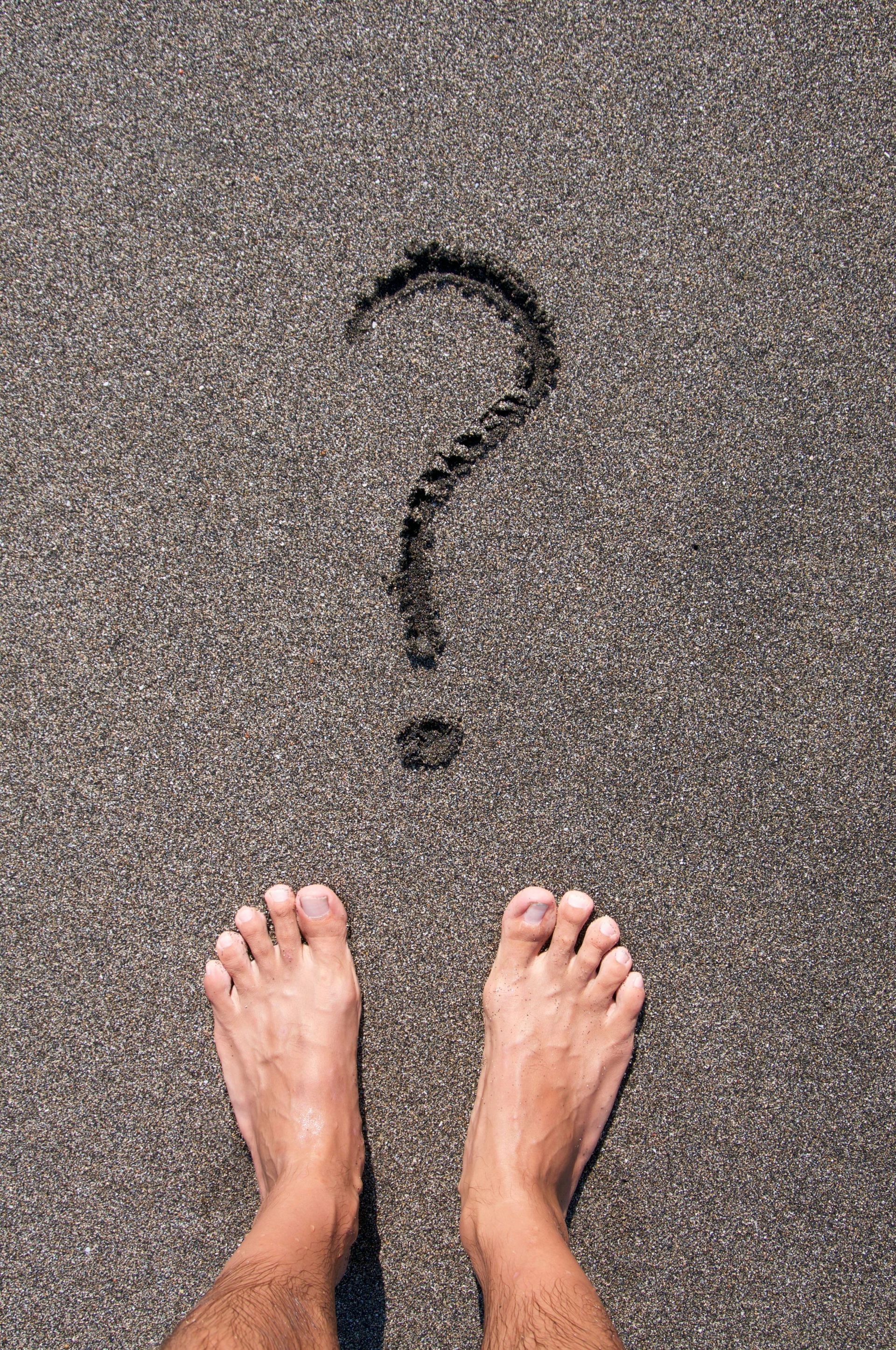 feet in the sand question mark
