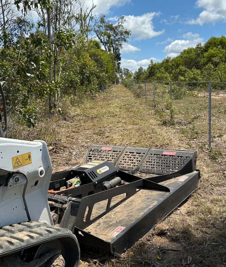 A Tractor Is Parked In The Middle Of A Field — AMW Contracting Co In Cobraball, QLD