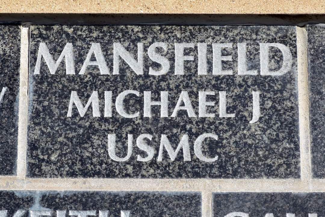 A sign that says mansfield michael j usmc on it
