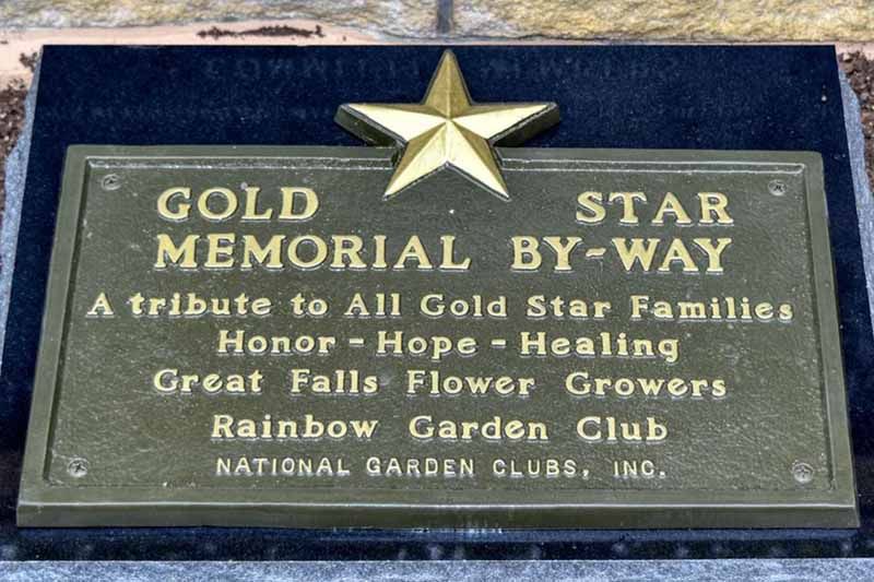 A plaque that says gold memorial star by way