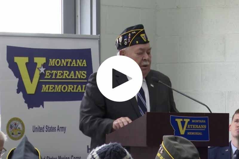 A man is giving a speech at the montana veterans memorial