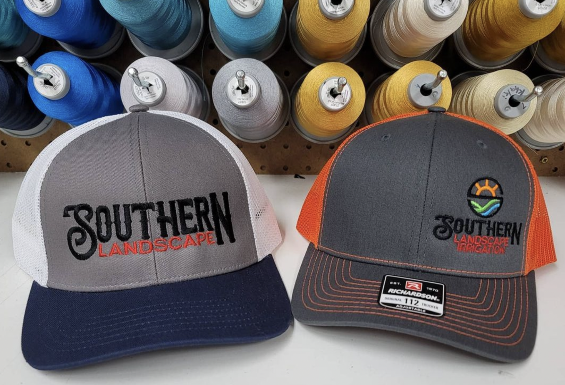 Two trucker hats with embroidered 