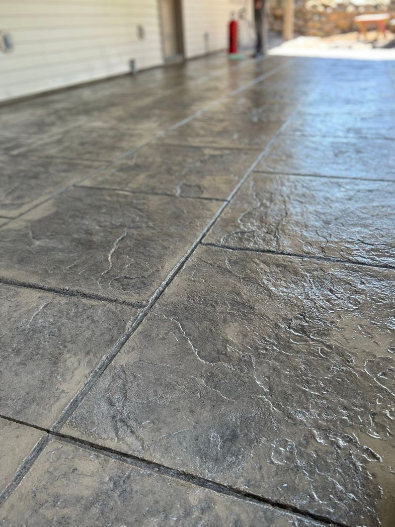 A close up of a concrete floor in a garage.