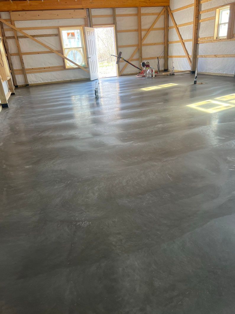 A concrete floor in a garage under construction.