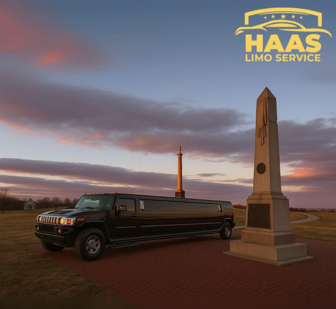 Black limo parked near a monument with a lighthouse in the background; Haas Limo Service logo visible.