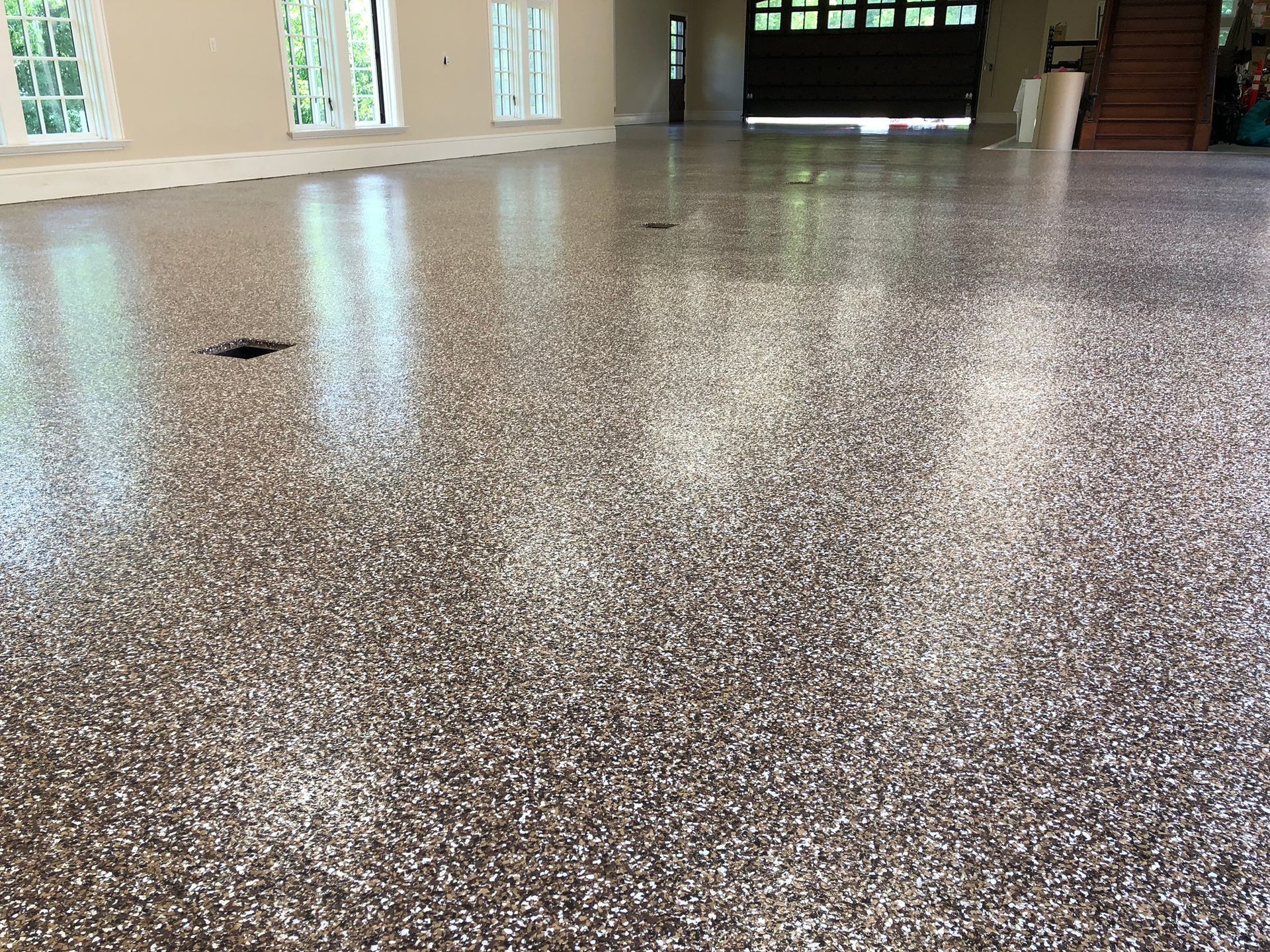 A garage floor with a lot of small rocks on it.