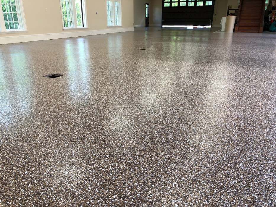 A garage floor with a lot of small stones on it.