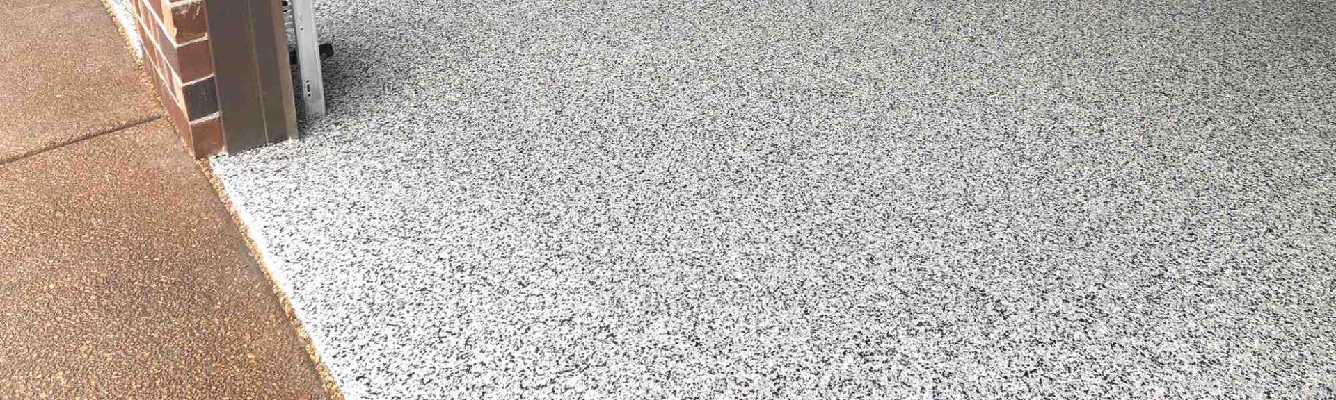 A close up of a carpeted floor next to a door.