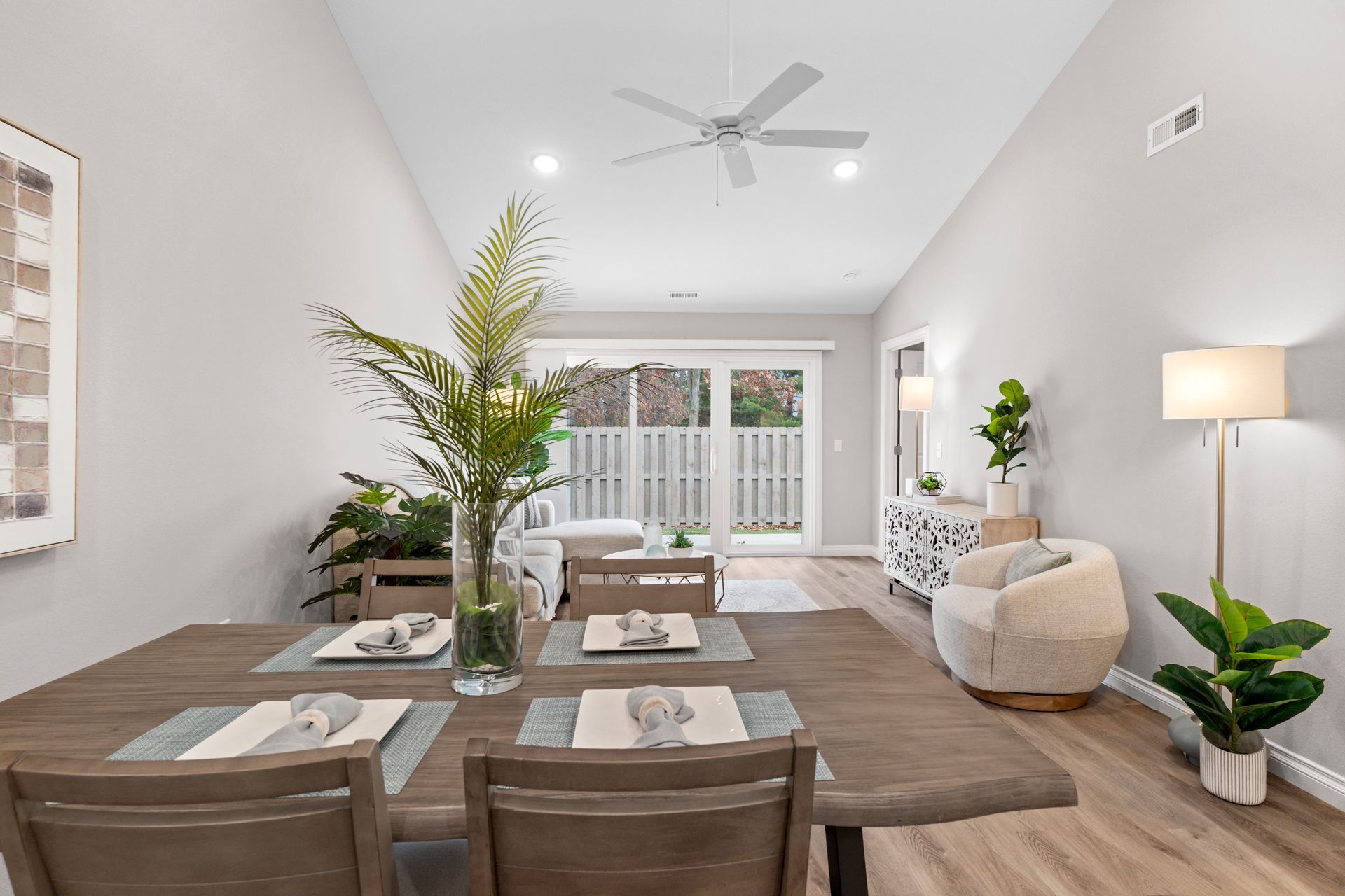 Photo of a dining area with the living room in the background