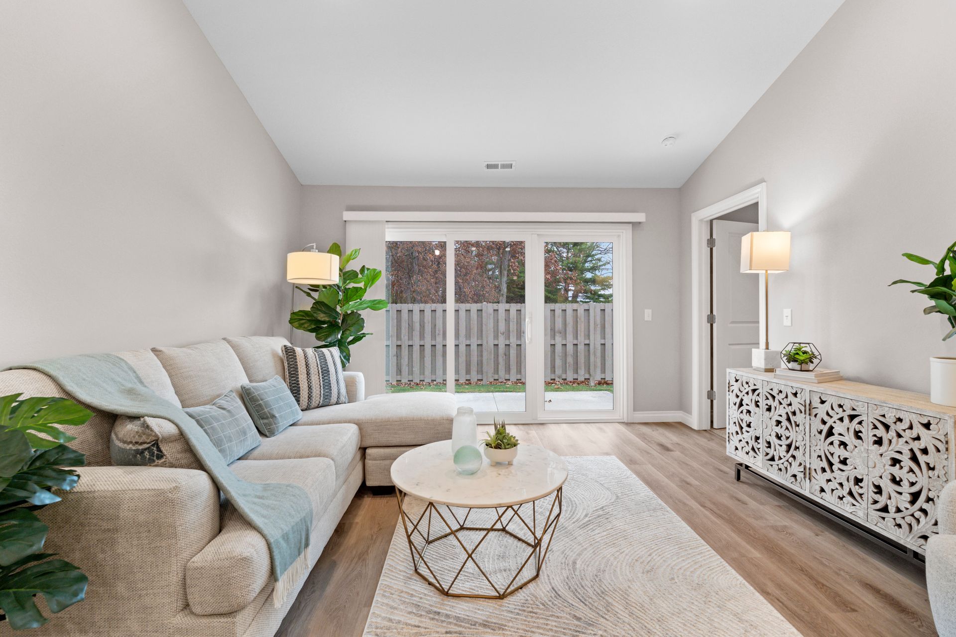 Photo of a living room with a patio in the background