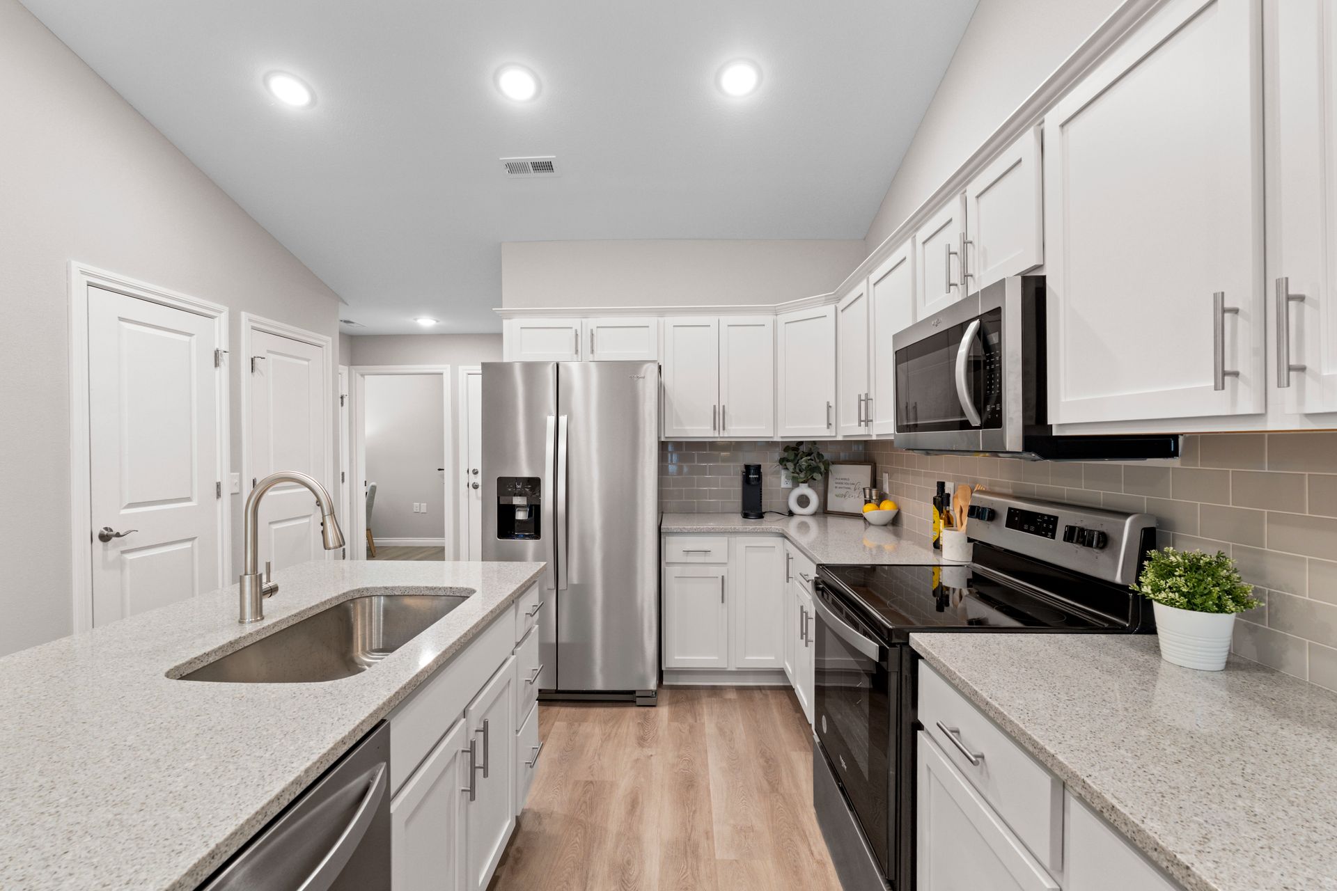 Photo of a kitchen showing appliances and an island area