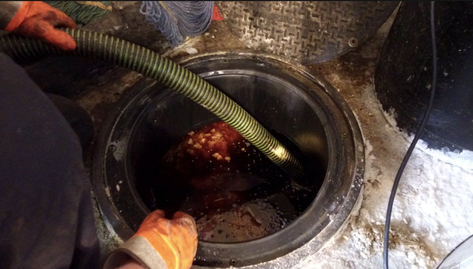 Cleaning the Grease — Clyman, WI — United Septic & Drain Services Inc
