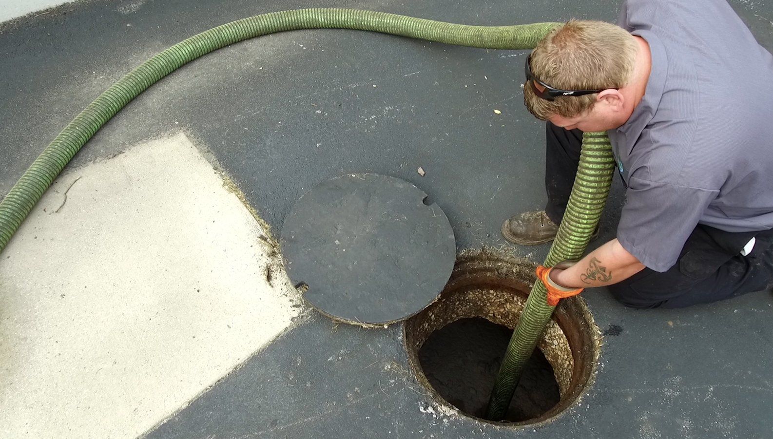 Cleaning the Septic Using a Hose — Clyman, WI — United Septic & Drain Services Inc