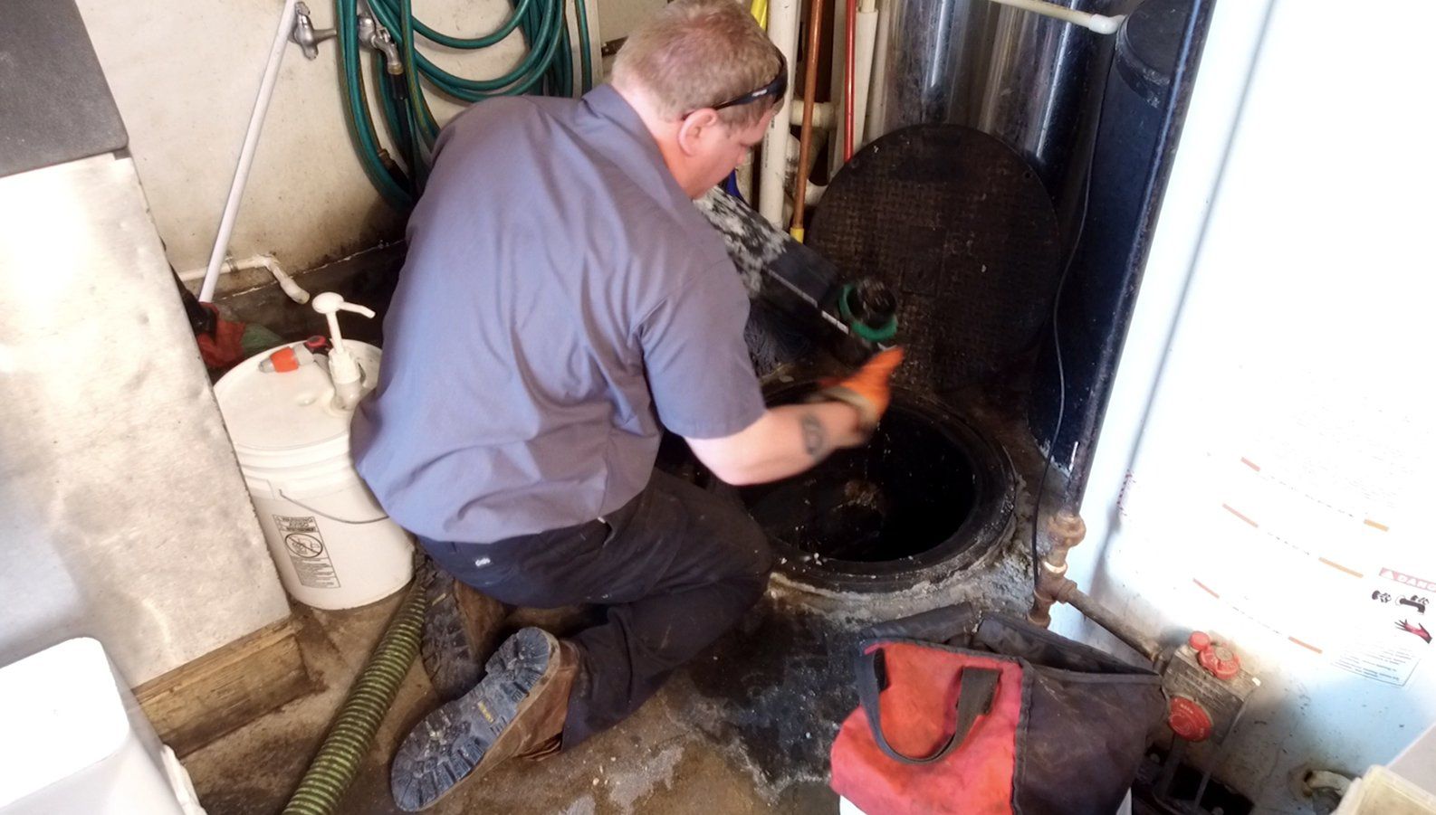 Man in Front of Septic — Clyman, WI — United Septic & Drain Services Inc