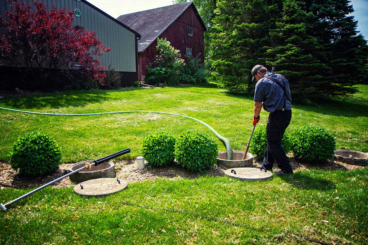 Man Checking the Septic — Clyman, WI — United Septic & Drain Services Inc