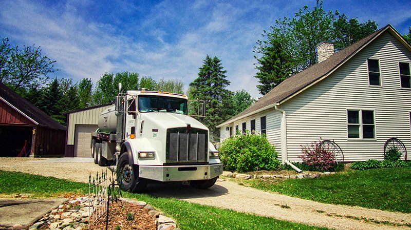 Septic Truck Outside the House — Clyman, WI — United Septic & Drain Services Inc