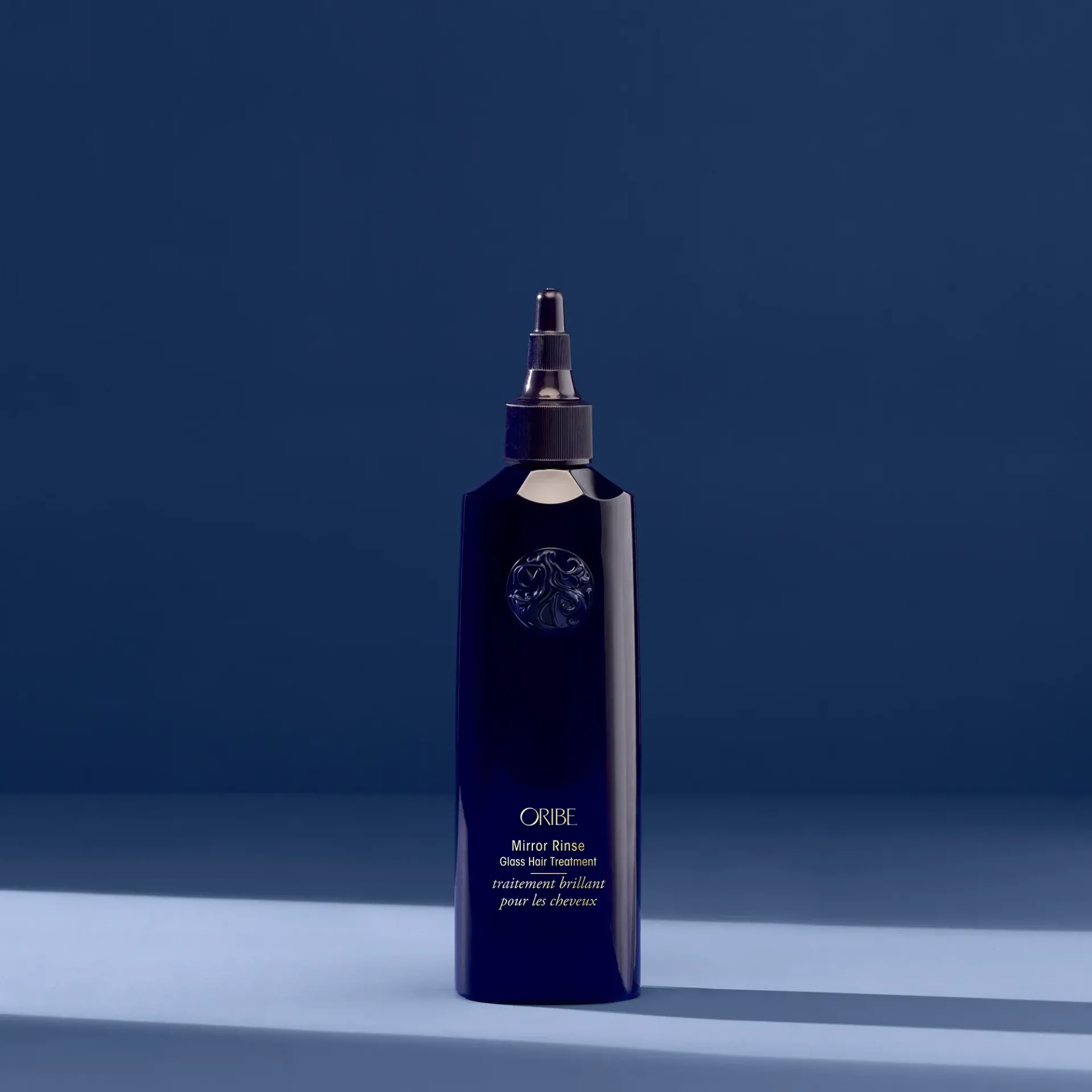 A purple bottle of serene scalp densifying shampoo