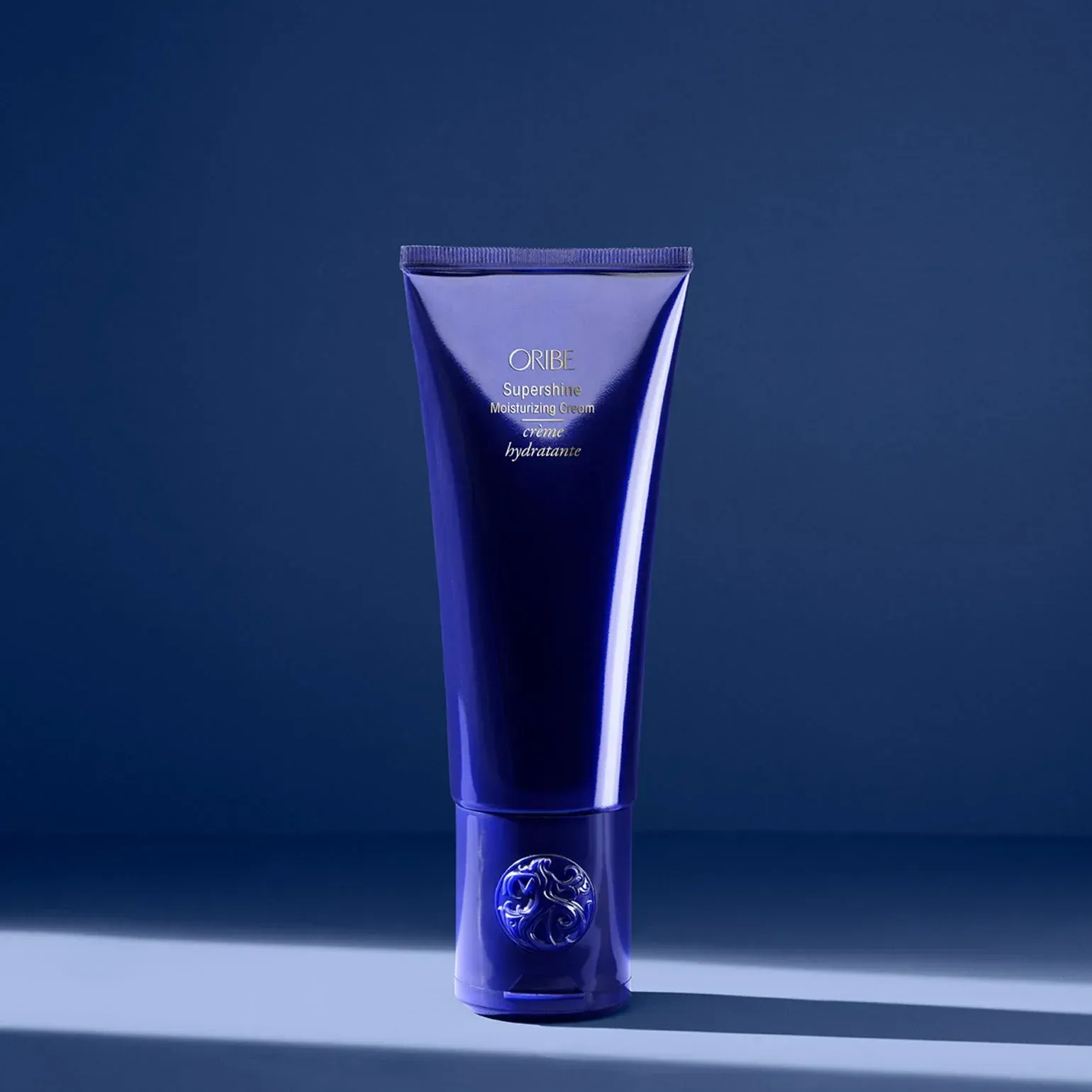 A white bottle of serene scalp densifying shampoo