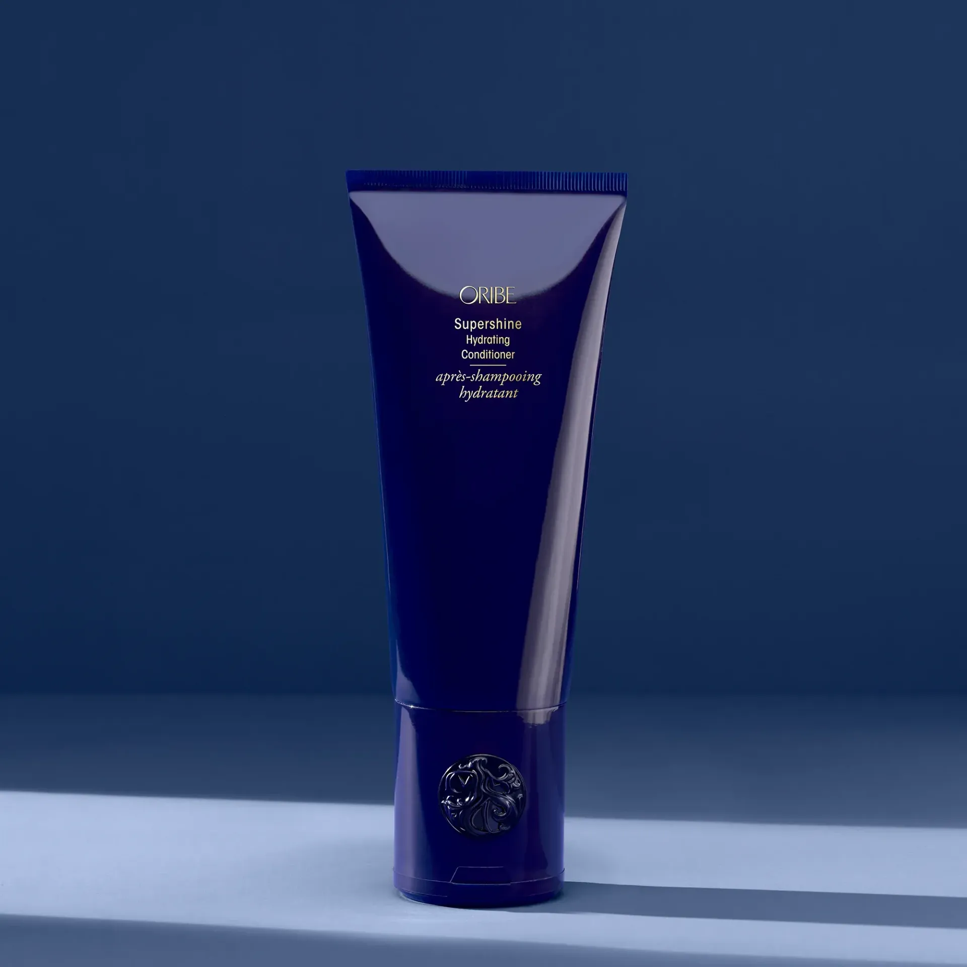 A purple bottle of serene scalp densifying shampoo