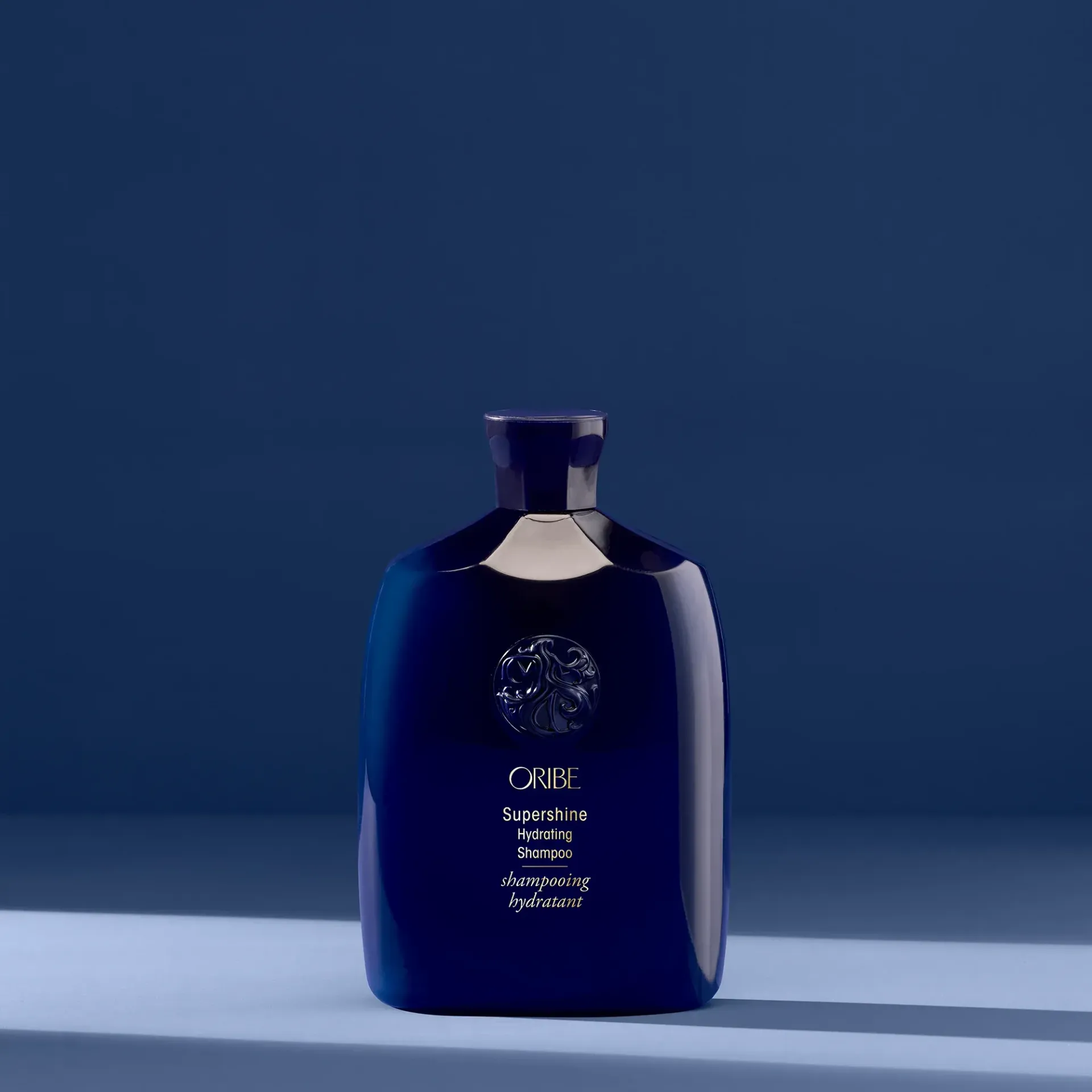 A white bottle of serene scalp densifying shampoo