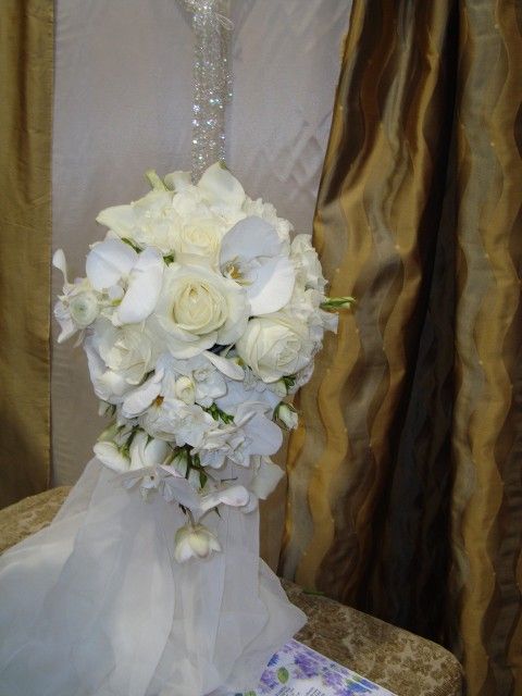A bouquet of white flowers is sitting on a table