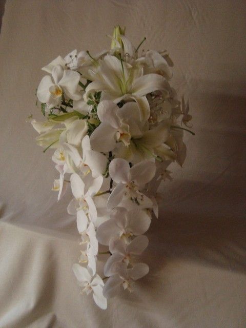 A bouquet of white flowers is sitting on a table