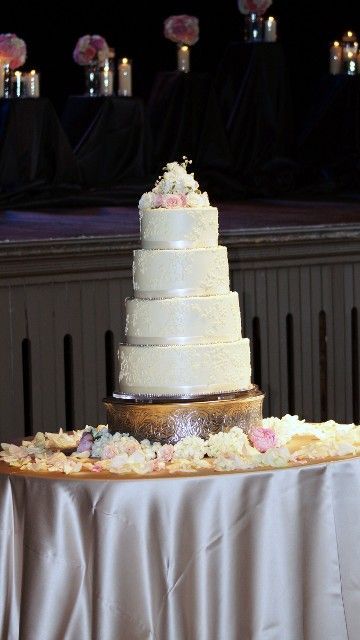 A wedding cake sitting on top of a table