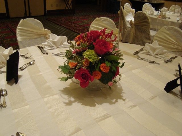 A table with a vase of flowers on it