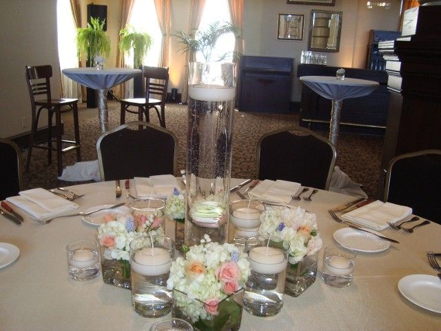 A table with flowers and candles on it