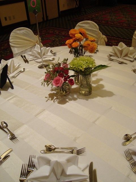A table with a vase of flowers on it