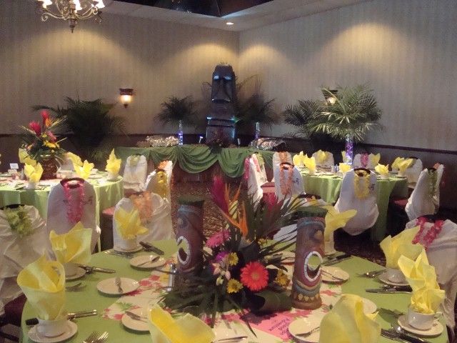 A room with tables and chairs set up for a party